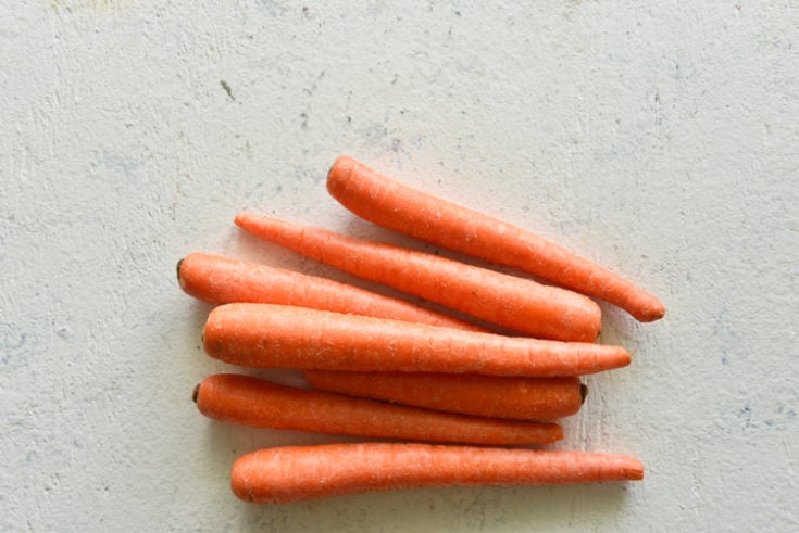 low carb vegetable list image of carrots on a white surface