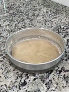 a round pan lined with parchment paper